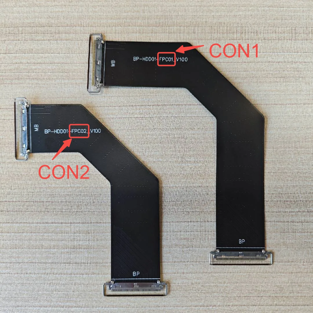 The two flat cables with the BP and MB ends labeled